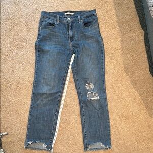 Distressed Levi’s 724 Blue Jeans